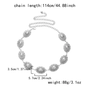 Detail showing vintage silver bohemian waist chain with engraved oval plates and lobster clasp