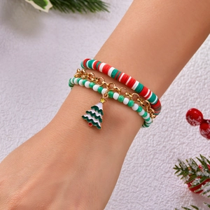 Three-piece Christmas layered bracelet set with Santa, snowflake, and tree charms