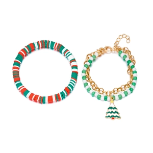 Detail of Christmas beaded bracelet set featuring a gold-framed enamel Christmas tree pendant