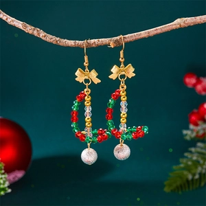 Detail of Christmas beaded hook earrings with red and green beads and a silver frosted ball