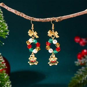 Detailed view of Christmas hoop earrings with colorful beads and golden bells decoration