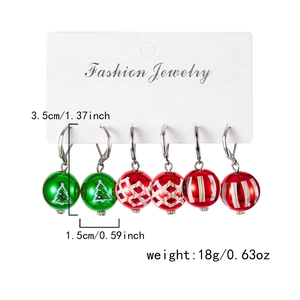 Détail du lot de boucles d'oreilles de Noël avec dimensions et poids sur carte