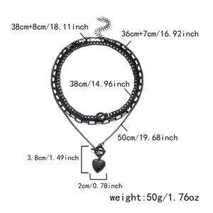 Detail view of multi-layer black necklace featuring OT buckle and heart pendant dimensions