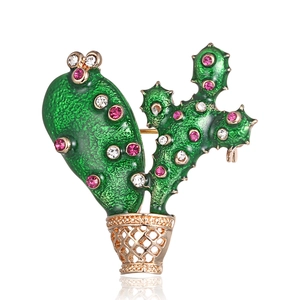 Exquisite cactus brooch with green enamel and sparkling rhinestones on golden pot