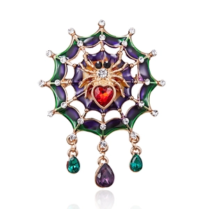 Detailed spider web brooch featuring a heart red crystal and purple enamel finish