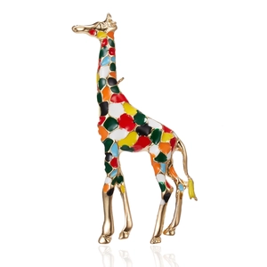 Detailed close-up of a golden alloy giraffe brooch with colorful enamel patterns