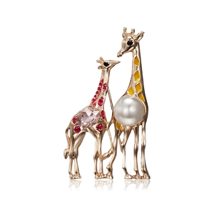 Detail of giraffe brooch set with gold plating, white pearl and pink gemstone accents