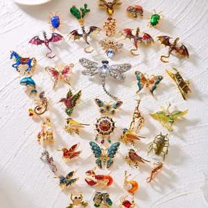 Collection of luxury enamel animal brooches with rhinestones in a heart arrangement