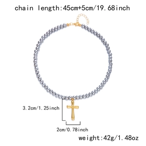 Detail showing cross necklace dimensions 3.2cm pendant with 45cm stone bead chain