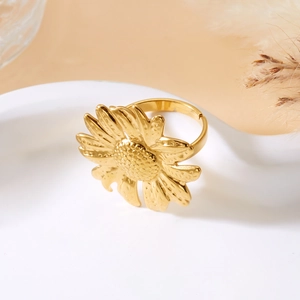 Detailed macro view of an adjustable golden sunflower ring with intricate petal textures