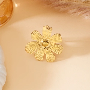Detailed macro view of a vintage gold flower ring featuring textured petals and center bud