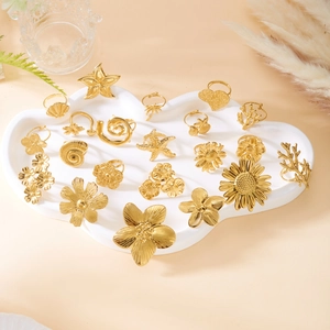 Adjustable gold stainless steel ring set featuring starfish and floral ocean designs