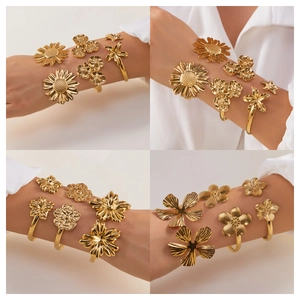 Goldenes Edelstahl-Armreif-Set mit filigranen hohlen Blumenmustern für Damen