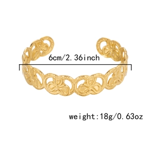 Detailed view of golden cuff bracelet showing 6cm diameter and 18g weight specs