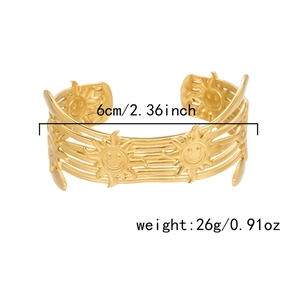 Detail of gold sun face cuff bangle with 6cm inner diameter and 26g weight specs
