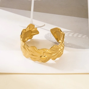 Detailed relief of leaves and strawberries on a gold-plated wide cuff bangle bracelet