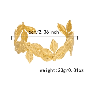 Detail showing dimensions of 6cm and 23g weight for the golden leaf open cuff bracelet