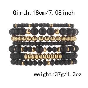 Detail of 7-layer black and gold beaded stretch bracelets showing 18cm circumference size