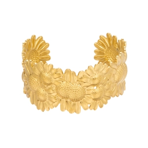 Detail of golden daisy sunflower cuff bracelet with a textured matte metal finish
