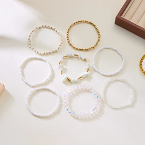 Set of 8 bohemian stretch bead bracelets with gold accents for layered stacking