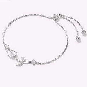 Detailed view of silver tulip bracelet featuring cat eye stone and adjustable box chain
