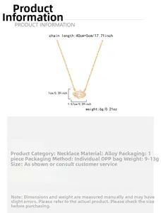 Detail of gold layered necklace featuring an eye-shaped zircon pendant with radial lines