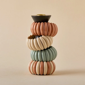 Close-up of four macaron-colored spiral phone line bracelets on a display stand