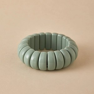 Detail of Morandi green elastic bracelet with smooth resin rectangular beads in vintage style