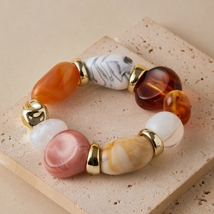 Vintage beach style bracelet with colorful irregular resin beads and gold-tone metal spacers