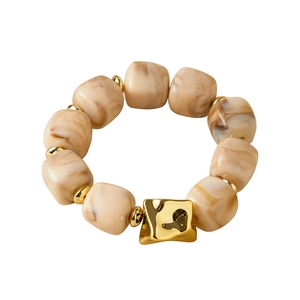 Irregular oval marble resin beaded bracelet with gold hammered metal accents