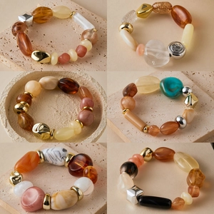Handmade elastic beaded bracelets featuring colorful acrylic and marble textures