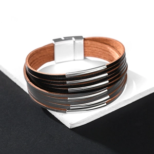Detail of multi-layer leather bracelet with silver metal tubes and magnetic clasp