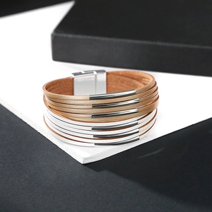 Close-up of dual-tone leather multi-layer bracelet with silver magnetic clasp closure