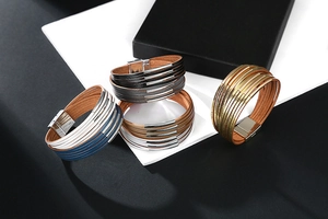 Detail view of multi-layer leather bracelets in five colors with polished magnetic clasps