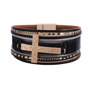 Bohemian multilayer leather bracelet with embossed gold cross charm and magnetic clasp