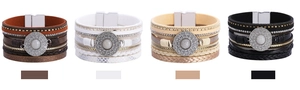Detail of bohemian multilayer leather bracelets with crystals and magnetic clasps