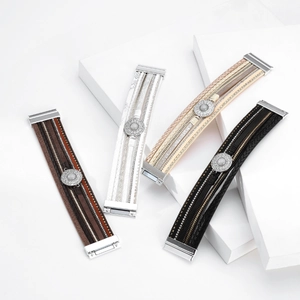 Detail of bohemian multilayer leather bracelets with crystals and magnetic clasps