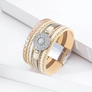 Detail of bohemian layered leather bracelet with crystal disc and magnetic metal clasp