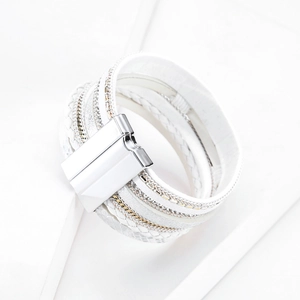 Detail of white bohemian multilayer leather bracelet with silver magnetic clasp closure
