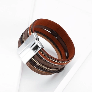 Detail of bohemian multilayer bracelet with rhinestones, leather bands, and magnetic clasp