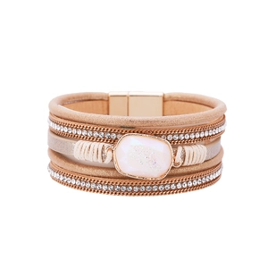 Close-up of Bohemian multi-layer leather bracelet with crystals and magnetic buckle