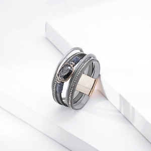 Detail of grey multi-layer wrap bracelet with crystal rhinestones and druzy stone