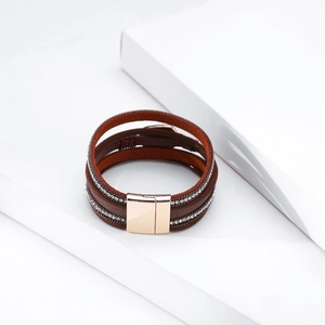 Detail of bohemian multilayer leather bracelet with silver crystals and magnetic metal clasp