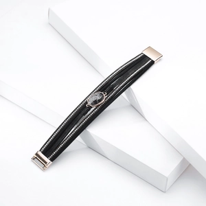 Detail of bohemian multi-layer leather bracelet with crystal stones and marble gem
