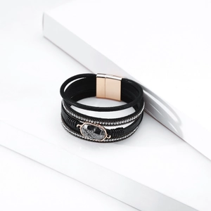 Detail of bohemian leather bracelet with crystal rhinestones and magnetic buckle