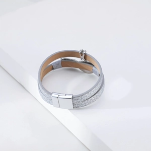 Close-up of silver double-wrap leather bracelet with metallic texture and magnetic clasp