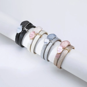 Multi-layer leather wrap bracelet with metallic leaf charms and sparkling rhinestones