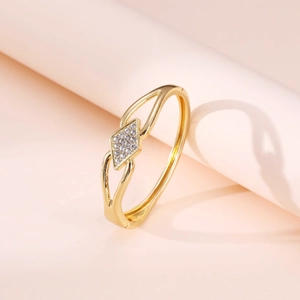 Gold minimalist open bangle featuring a geometric rhombus design with white zircon pavé
