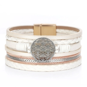 Macro view of bohemian multi-layer leather bracelet with flower of life charm and magnetic clasp