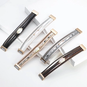Detailed view of multi-layer wrap leather bracelets with faux pearls and magnetic clasps